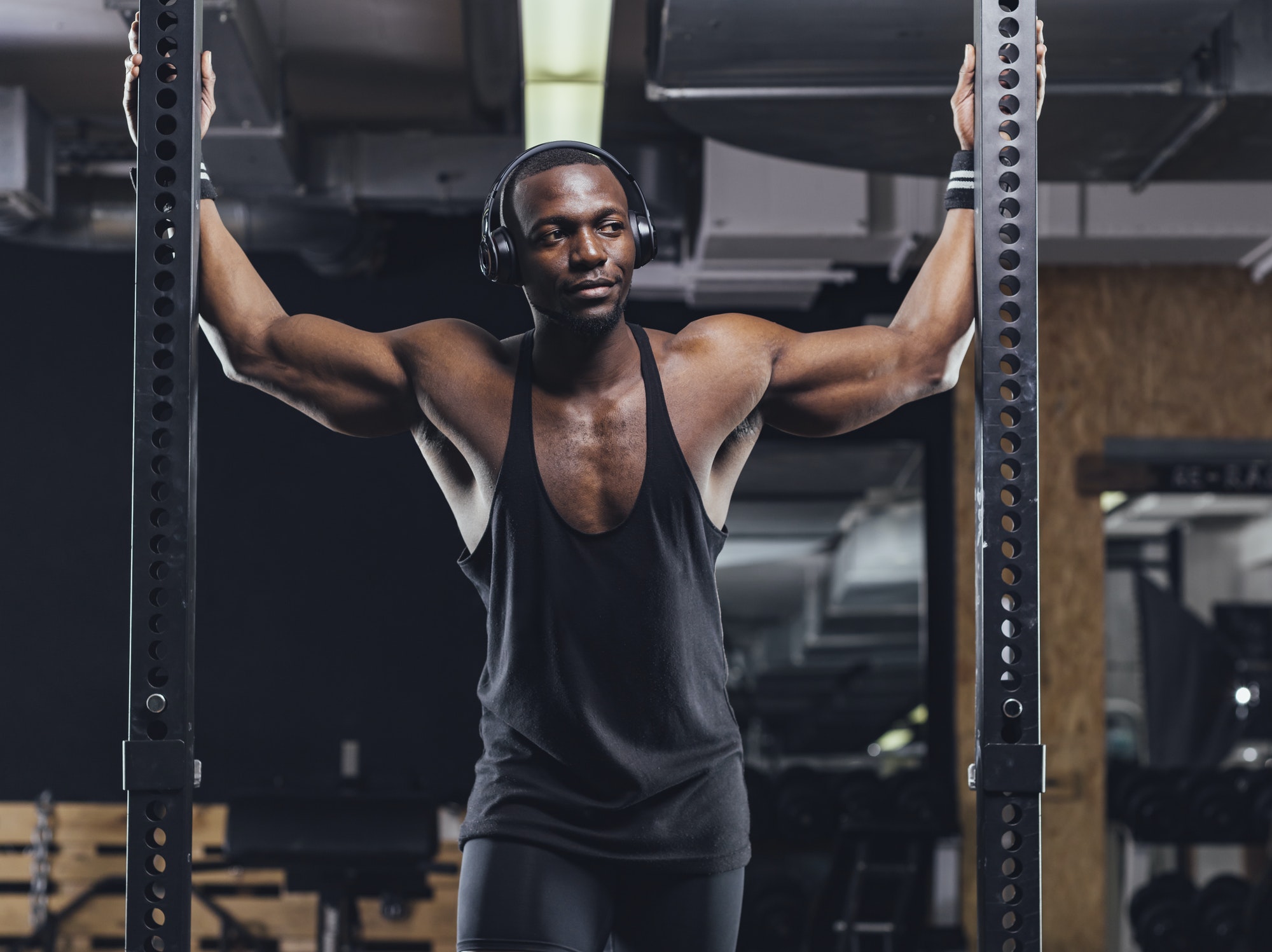 Athlete standing in gym, preparing for training